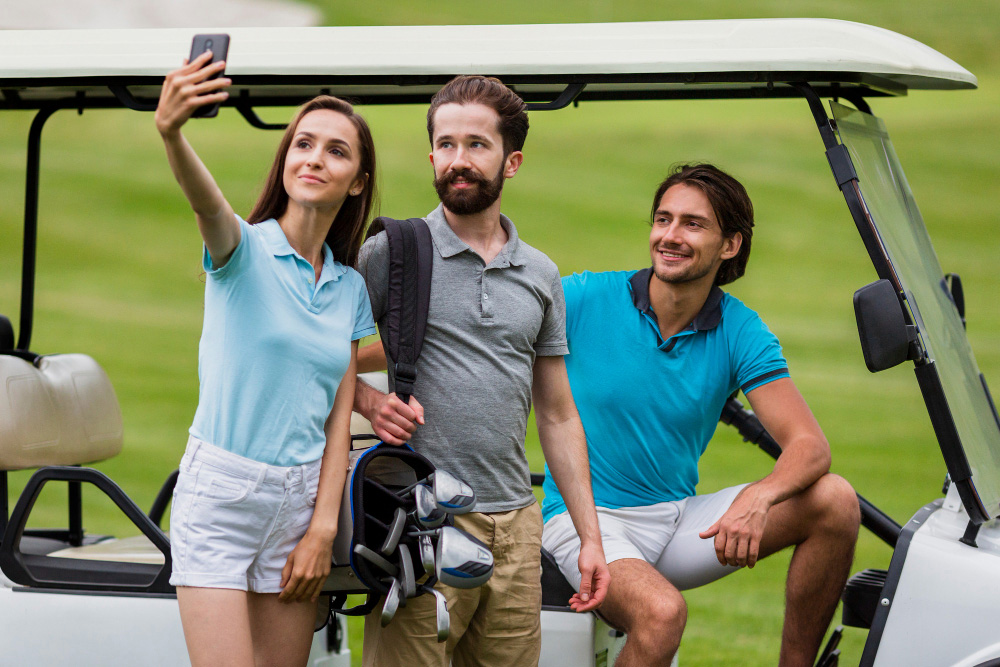 girl-taking-selfie-with-friends-golf-field.jpg
